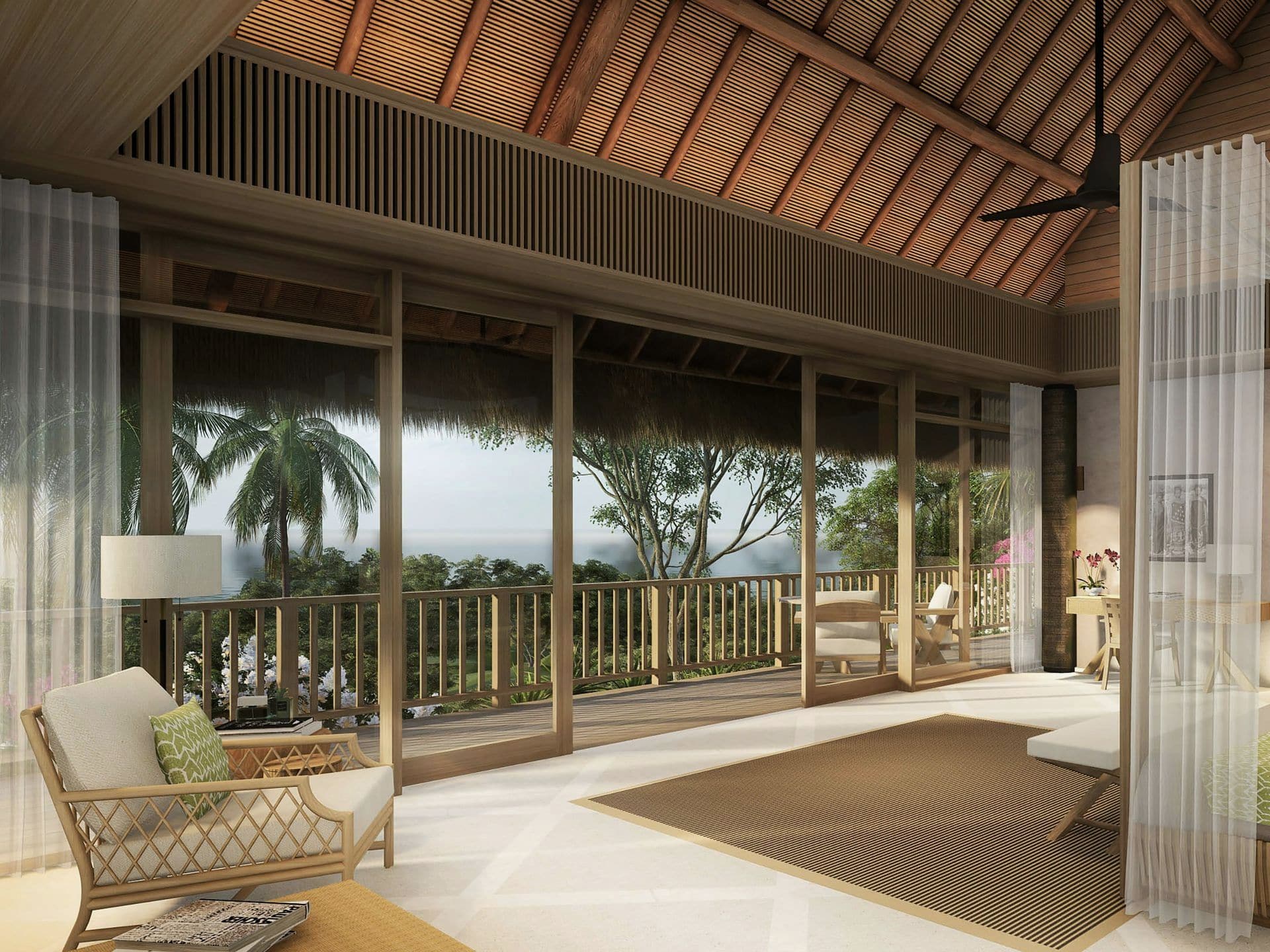 Открытая гостиная виллы под высокой кровлей с видом на тропический сад
